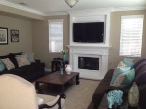 fireplace mantel with crown molding and flat screen TV